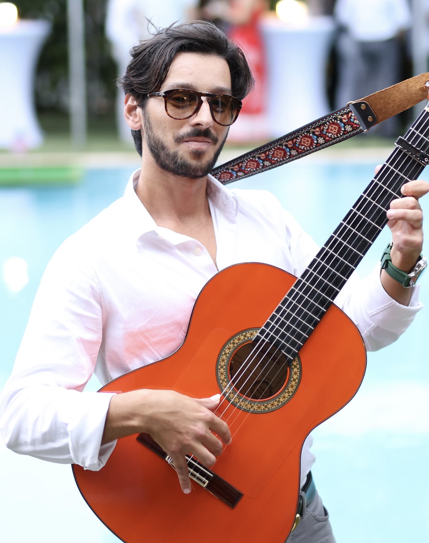 Sergio De Gouveia playing Spanish guitar live at a South Florida event